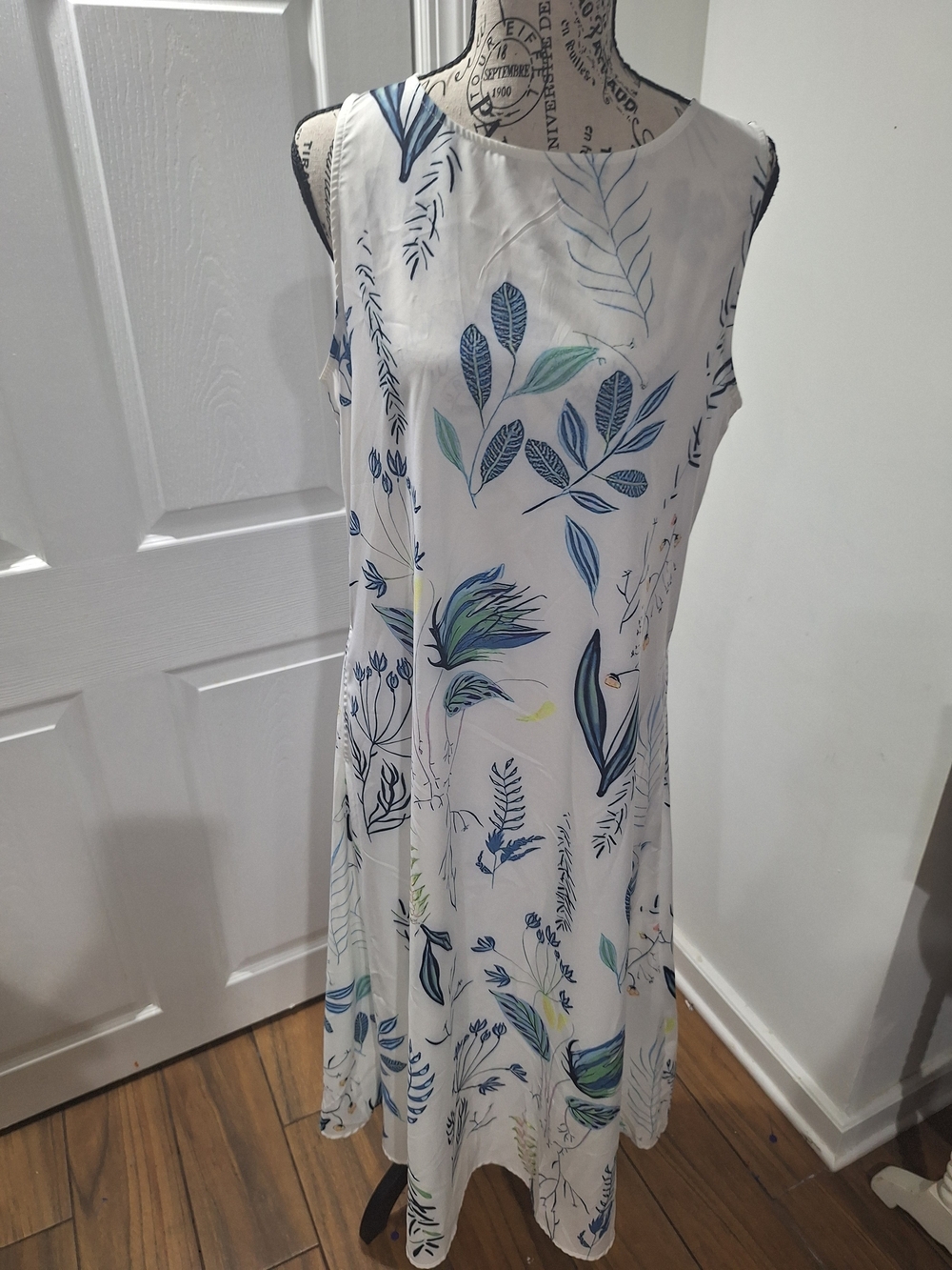 Sleeveless White Maxi Dress with Blue & Green Leaf Print